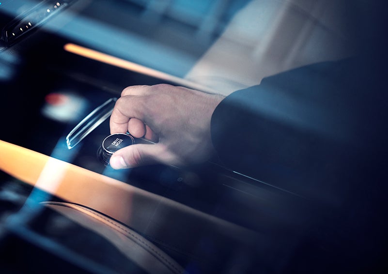 The driver of a 2023 Lincoln Corsair® SUV is shown adjusting the drive mode. | Don Franklin Lincoln in London KY