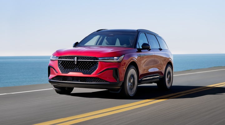 A 2024 Lincoln Nautilus® SUV is being driven on a seaside roadway. | Don Franklin Lincoln in London KY