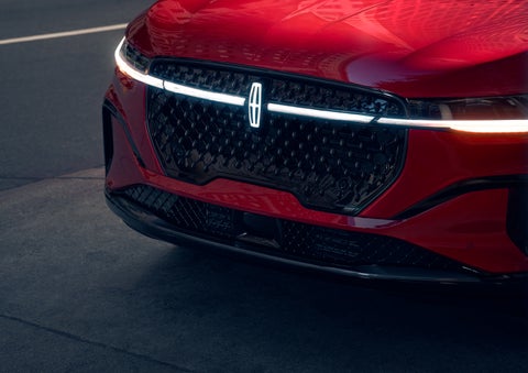 The available front LED light bar and center Lincoln Star logo glow at dusk. | Don Franklin Lincoln in London KY