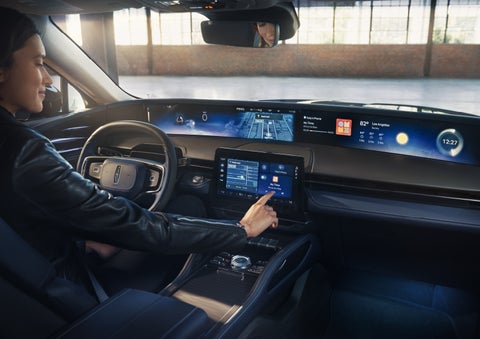 The driver of a 2026 Lincoln Nautilus® SUV interacts with the center touchscreen. | Don Franklin Lincoln in London KY