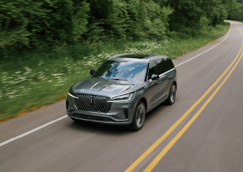 A 2027 Lincoln Aviator® SUV is being driven down a road. | Don Franklin Lincoln in London KY