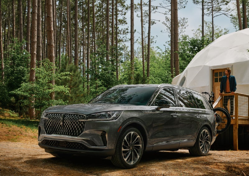 A 2027 Lincoln Aviator® is parked next to a high end glamping site. | Don Franklin Lincoln in London KY