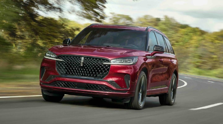 A 2027 Lincoln Aviator® SUV is being driven on a country road | Don Franklin Lincoln in London KY