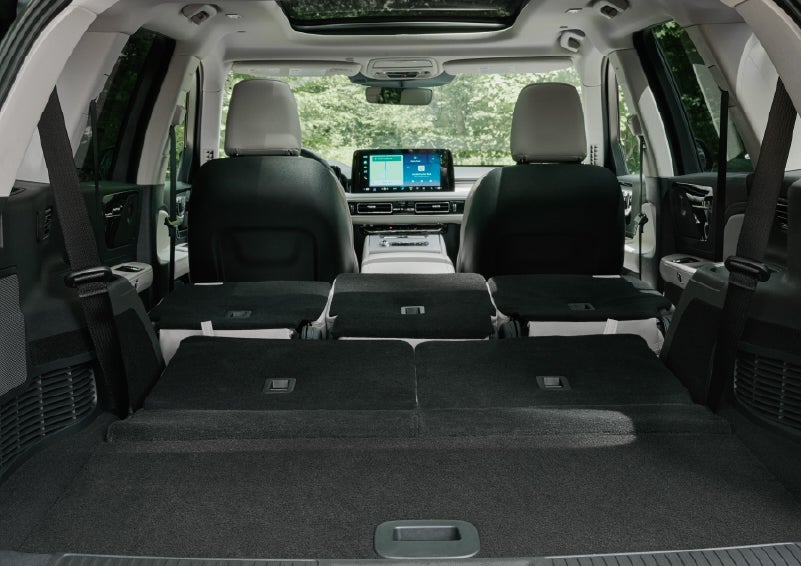 A rear to front view of the interior of a 2027 Lincoln Aviator® Black Label™ SUV shows the third and second rows folded flat | Don Franklin Lincoln in London KY